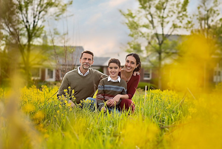 Family portrait surrounded by yellow flowers