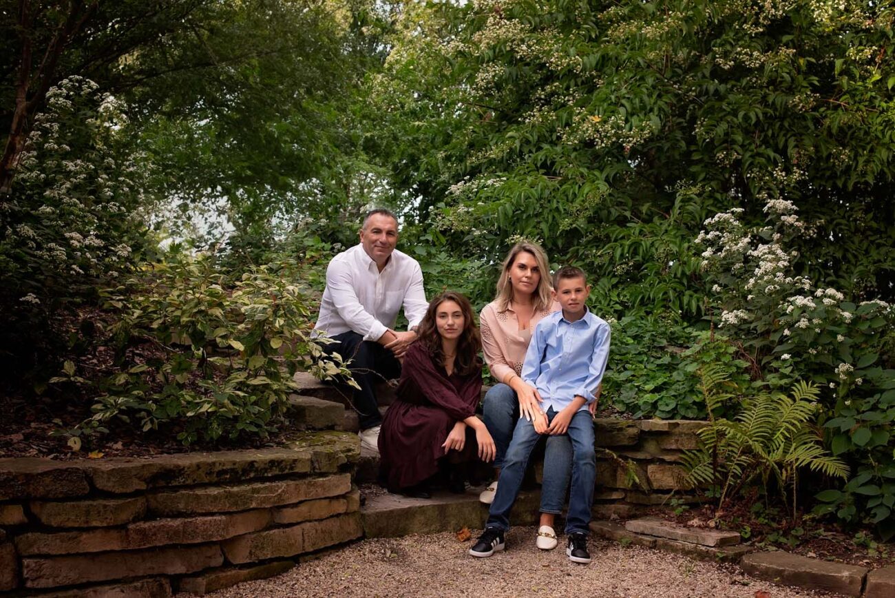 Family photograph in a lush green setting