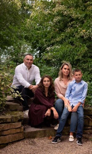 Family photograph in a lush green setting