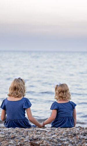 Sibling photos on teh beach